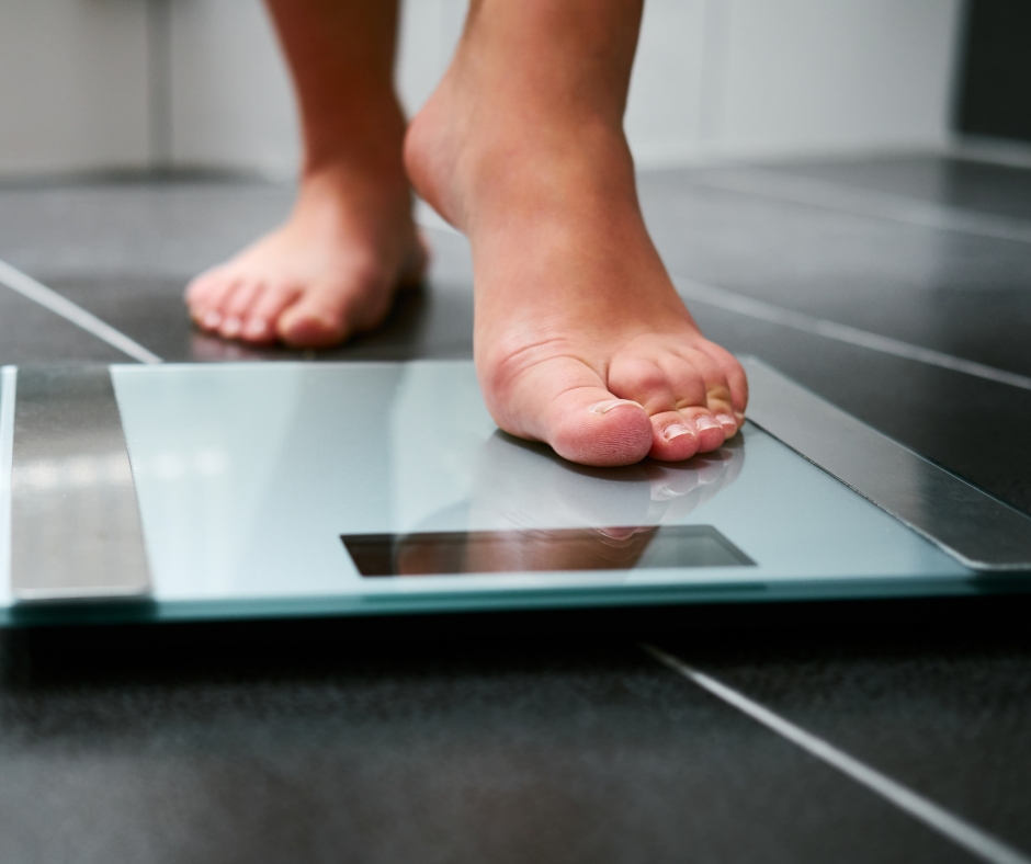 foot stepping on scale